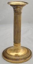 Early 19th Century Set of Four Gilded Old Sheffield Plate Candlesticks.