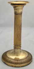Early 19th Century Set of Four Gilded Old Sheffield Plate Candlesticks.