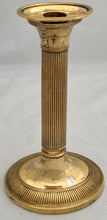 Early 19th Century Set of Four Gilded Old Sheffield Plate Candlesticks.