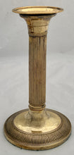 Early 19th Century Set of Four Gilded Old Sheffield Plate Candlesticks.