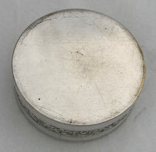 French Silvered Circular Table Snuff Box Engraved with 'La Mort de L'Oiseau', after Jean-Baptiste Greuze. Circa 1900.
