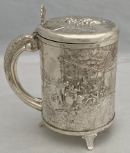 A Northern European Style Silver Plated Lidded Tankard with Relief Detail.