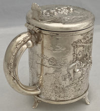 A Northern European Style Silver Plated Lidded Tankard with Relief Detail.