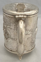 A Northern European Style Silver Plated Lidded Tankard with Relief Detail.