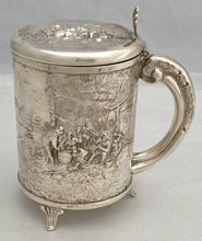 A Northern European Style Silver Plated Lidded Tankard with Relief Detail.