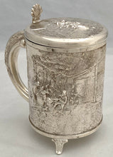 A Northern European Style Silver Plated Lidded Tankard with Relief Detail.