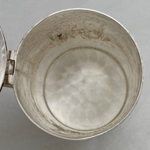 A Northern European Style Silver Plated Lidded Tankard with Relief Detail.