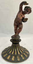 Bronzed Classical Putto Figurine Raised on a Fluted Brass Base.