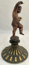 Bronzed Classical Putto Figurine Raised on a Fluted Brass Base.