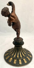 Bronzed Classical Putto Figurine Raised on a Fluted Brass Base.