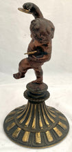 Bronzed Classical Putto Figurine Raised on a Fluted Brass Base.