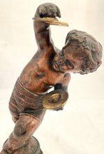 Bronzed Classical Putto Figurine Raised on a Fluted Brass Base.