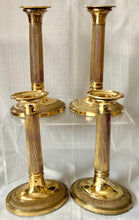 Early 19th Century Set of Four Gilded Old Sheffield Plate Candlesticks.
