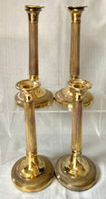 Early 19th Century Set of Four Gilded Old Sheffield Plate Candlesticks.