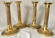 Early 19th Century Set of Four Gilded Old Sheffield Plate Candlesticks.