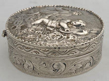 Continental White Metal Putti Relief Snuff Box with Gilded Interior. 1.9 troy ounces.