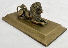 A Regency Period Desk Weight, Cast as a Recumbent Lion, circa 1820.