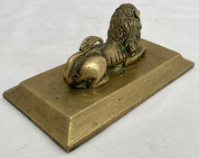 A Regency Period Desk Weight, Cast as a Recumbent Lion, circa 1820.