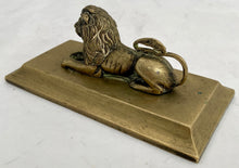 A Regency Period Desk Weight, Cast as a Recumbent Lion, circa 1820.