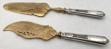 Pair of French Silver Handled Gilt Metal Servers, Circa 1890 - 1910.