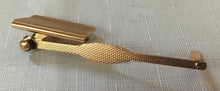 Asprey 9 carat gold cased page marker. London 1929 Asprey & Co. Ltd. 7.3 grams.
