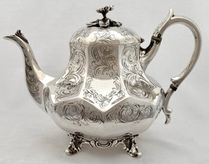 Victorian Silver Plated Four Piece Tea & Coffee Set of Panelled Form on Scroll Feet, circa 1870.