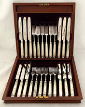 George III Cased Set of Crested Silver & Mother of Pearl Dessert Knives & Forks for Twelve, circa 1810.