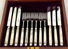 George III Cased Set of Crested Silver & Mother of Pearl Dessert Knives & Forks for Twelve, circa 1810.