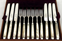 George III Cased Set of Crested Silver & Mother of Pearl Dessert Knives & Forks for Twelve, circa 1810.