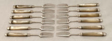 George III Cased Set of Crested Silver & Mother of Pearl Dessert Knives & Forks for Twelve, circa 1810.