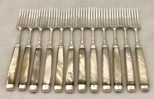 George III Cased Set of Crested Silver & Mother of Pearl Dessert Knives & Forks for Twelve, circa 1810.