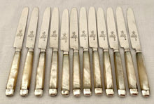 George III Cased Set of Crested Silver & Mother of Pearl Dessert Knives & Forks for Twelve, circa 1810.