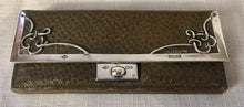 Art Nouveau silver framed leather purse, retailed by Partidge & Cooper of Fleet Street, London. Birmingham 1900 Frederick Wich.