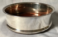 Asprey, Elizabeth II, silver wine coaster with turned wood base. Birmingham 1994 Asprey plc.