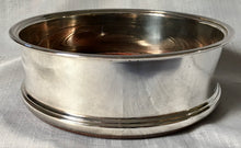 Asprey, Elizabeth II, silver wine coaster with turned wood base. Birmingham 1994 Asprey plc.