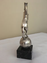 Beautifully cast silver plated rearing horse atop a silver plated globe.