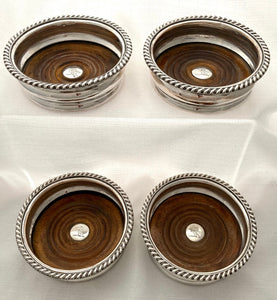 Georgian Set of Four Old Sheffield Plate Crested Wine Coasters, circa 1820.