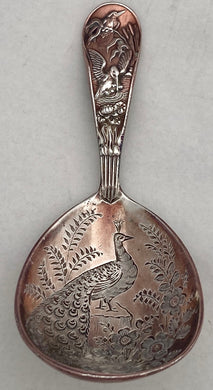 Victorian Aesthetic Movement Silver Plate on Copper Caddy Spoon, circa 1880 - 1900.
