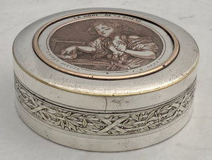 French Silvered Circular Table Snuff Box Engraved with 'La Mort de L'Oiseau', after Jean-Baptiste Greuze. Circa 1900.