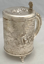 A Northern European Style Silver Plated Lidded Tankard with Relief Detail.