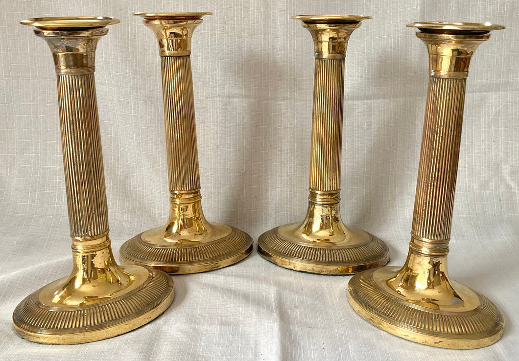 Early 19th Century Set of Four Gilt Copper Candlesticks.