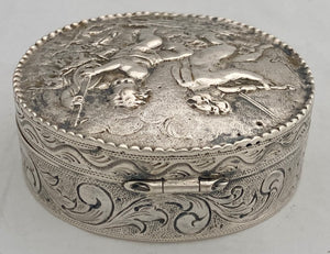 Continental White Metal Putti Relief Snuff Box with Gilded Interior. 1.9 troy ounces.