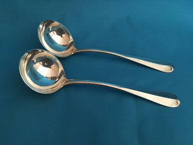 Edwardian heavy pair of silver crested, rat tail, sauce ladles. London 1901 Francis Higgins III. 5.33 troy ounces.