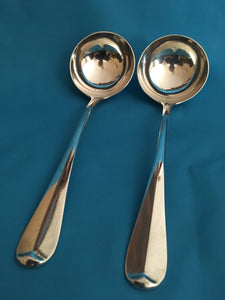 Edwardian heavy pair of silver crested, rat tail, sauce ladles. London 1901 Francis Higgins III. 5.33 troy ounces.