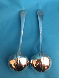 Edwardian heavy pair of silver crested, rat tail, sauce ladles. London 1901 Francis Higgins III. 5.33 troy ounces.
