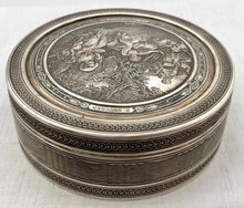 Edwardian Circular Silver Box. Engraved with Le Denicheur, after Boucher. London 1910 Andrew Barrett & Sons. 6.7 troy ounces.