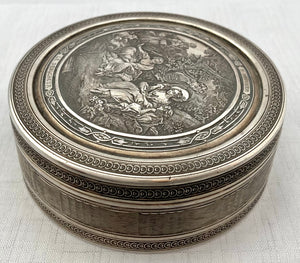 Edwardian Circular Silver Box. Engraved with Le Denicheur, after Boucher. London 1910 Andrew Barrett & Sons. 6.7 troy ounces.