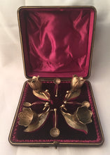 Victorian cased set of four novelty gilt metal salts and spoons, in the form of flowers and leaves.