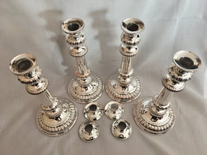 Late Georgian, matching set of four Sheffield Plated candlesticks.