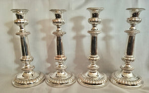 Late Georgian, matching set of four Sheffield Plated candlesticks.